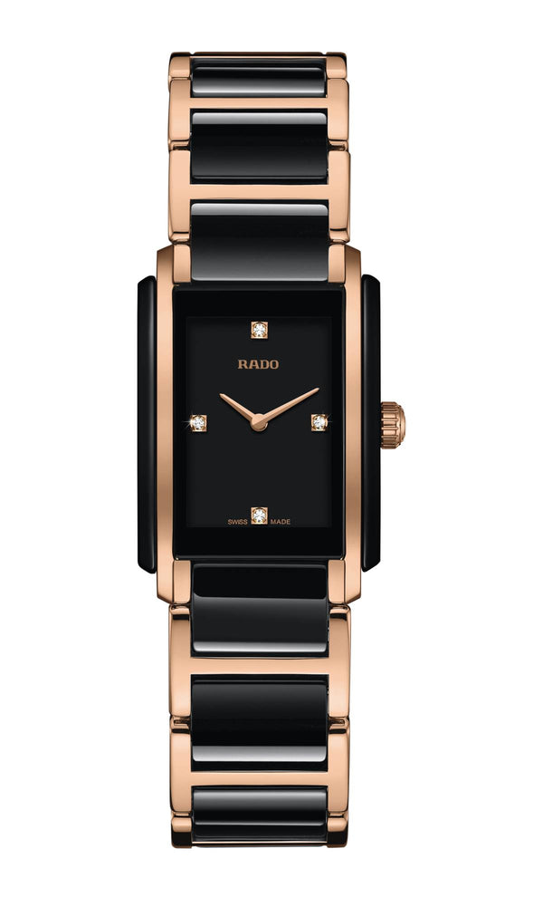 Radiolography image of a black and rose gold watch with a white background