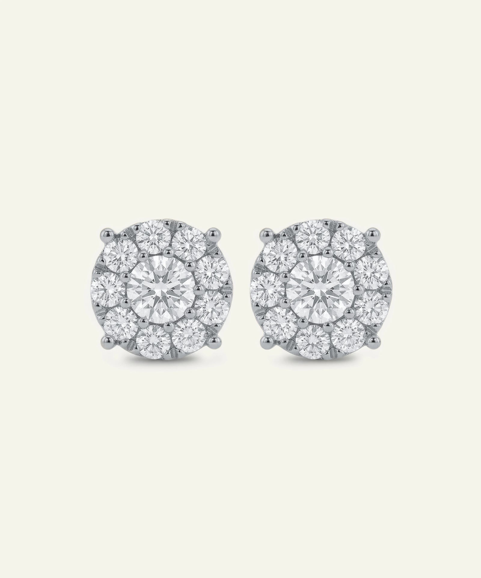 Pair of diamond stud earrings on a light gray background