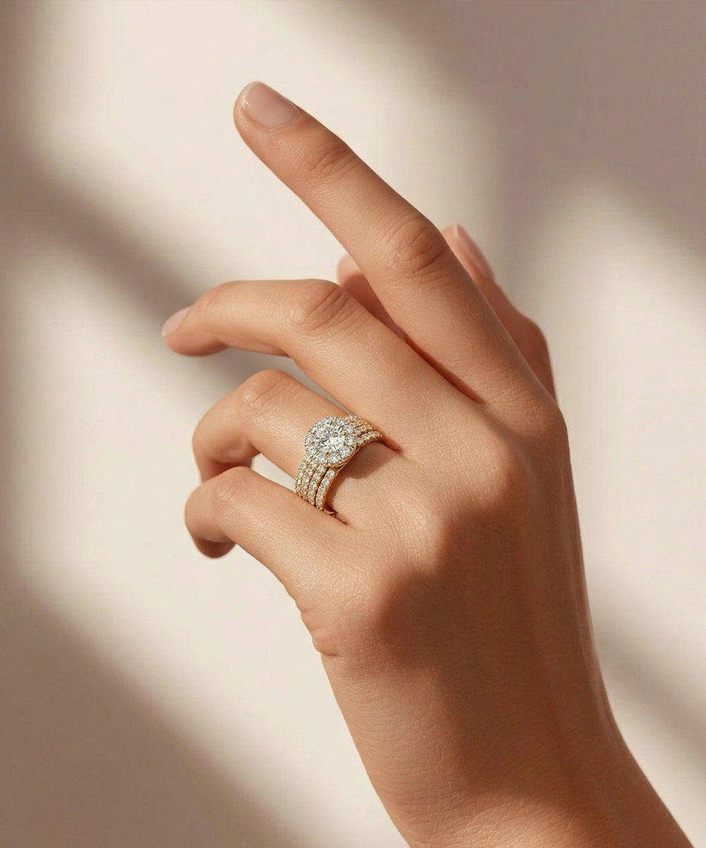 Hand wearing a diamond ring on a soft background