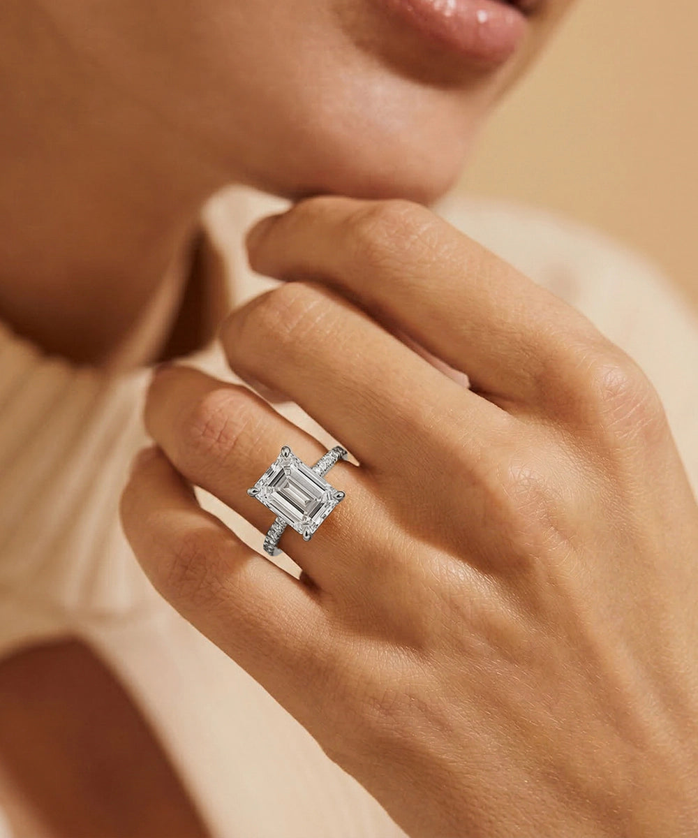 Diamond ring on a hand with a soft focus background