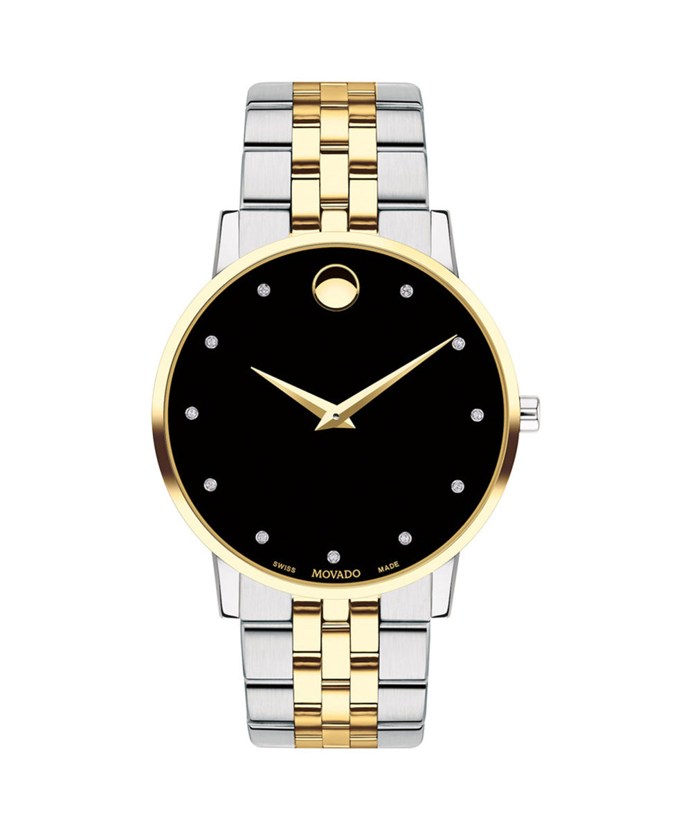 Two-tone silver and gold watch with black face on a white background