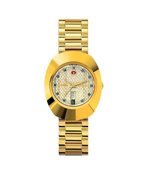 Gold wristwatch with a decorative face on a white background