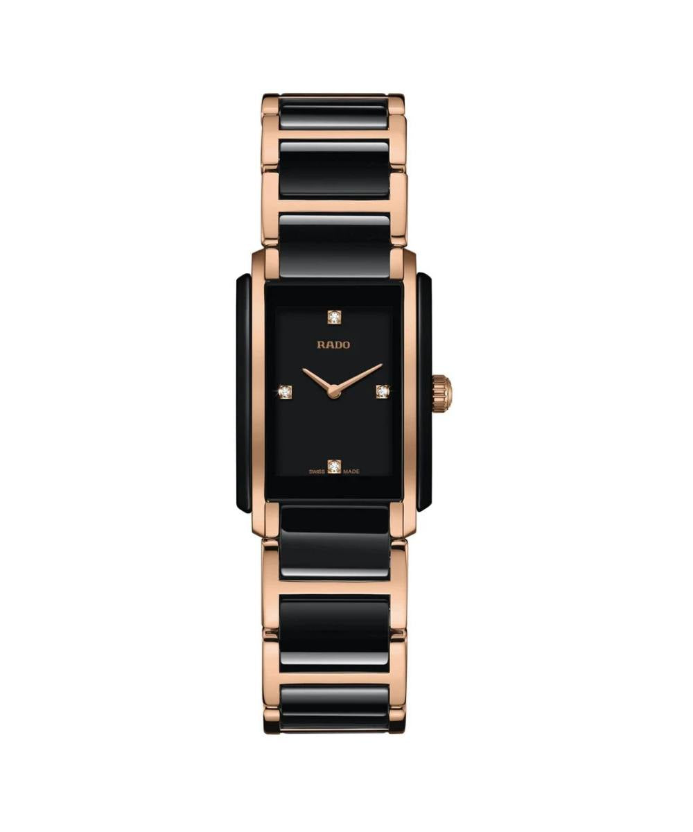Watch with black face and rose gold band on a white background