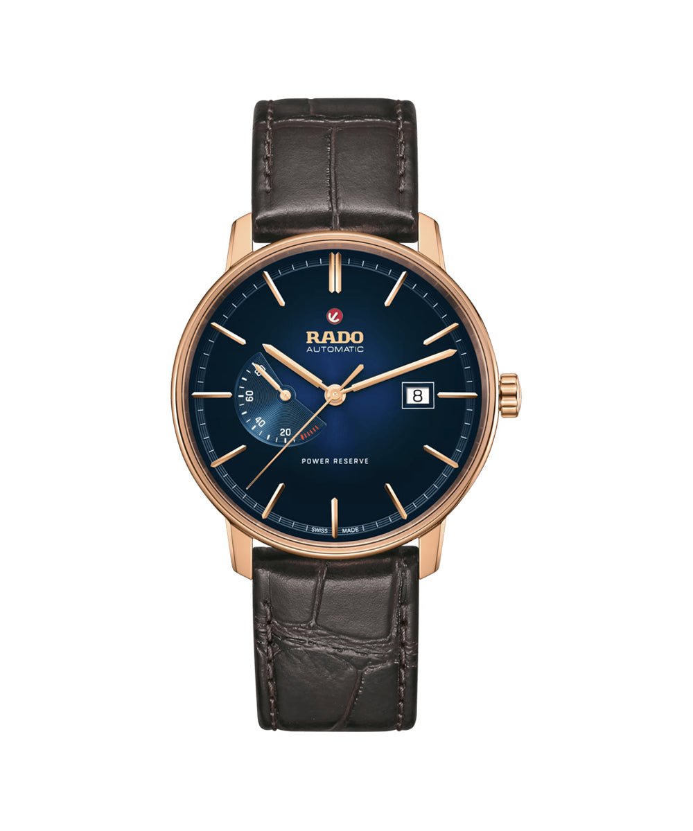 Rado watch with black leather strap and blue dial on a white background