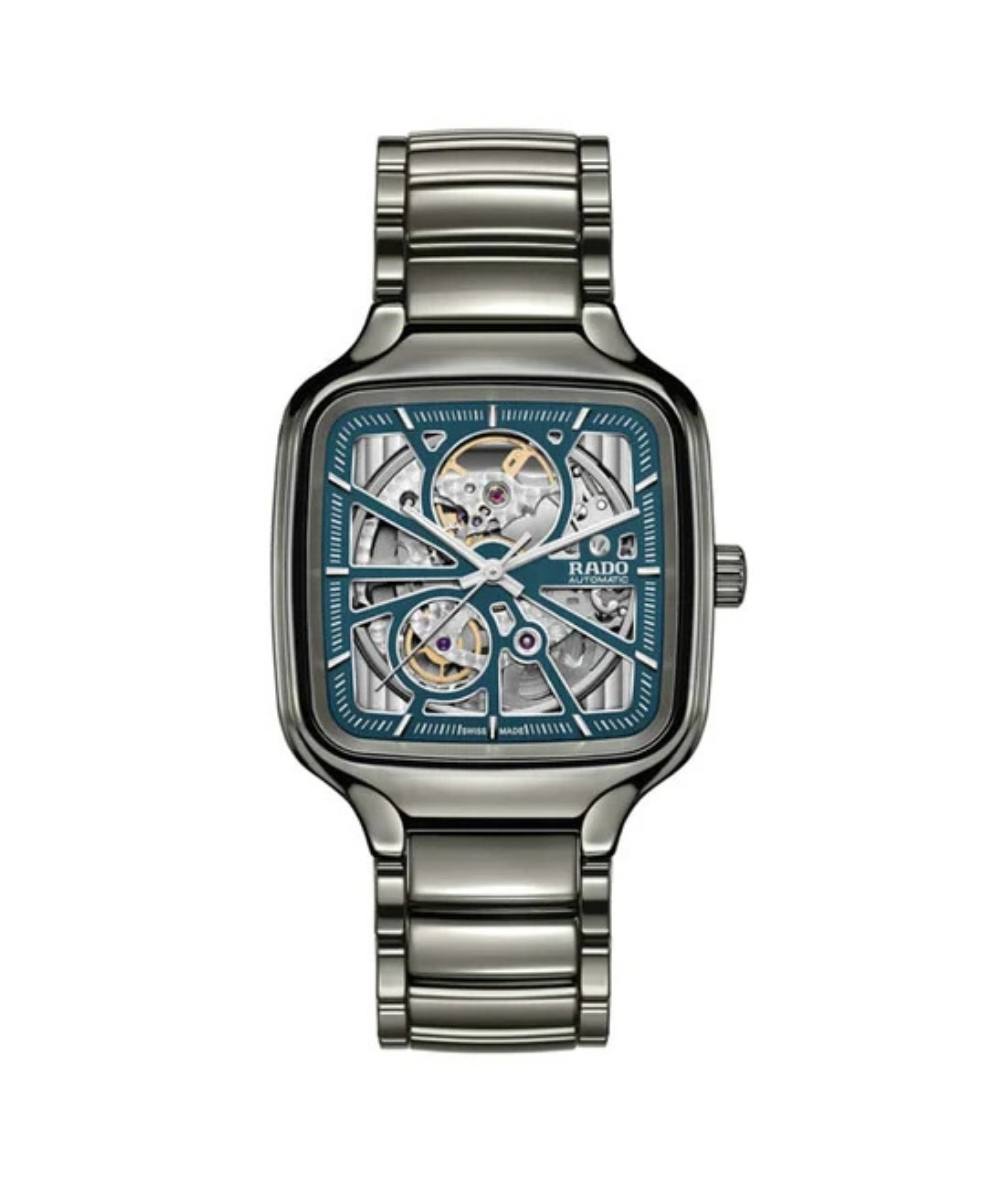 Silver watch with a blue face on a white background