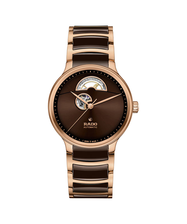 Brown and rose gold watch with Rado logo on a white background