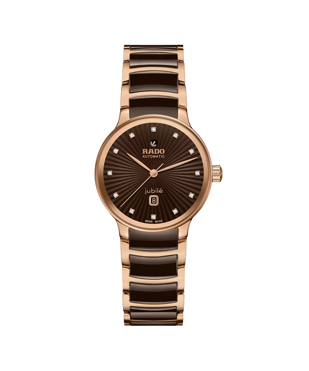Rose gold and brown ceramic watch with Rado branding on a white background