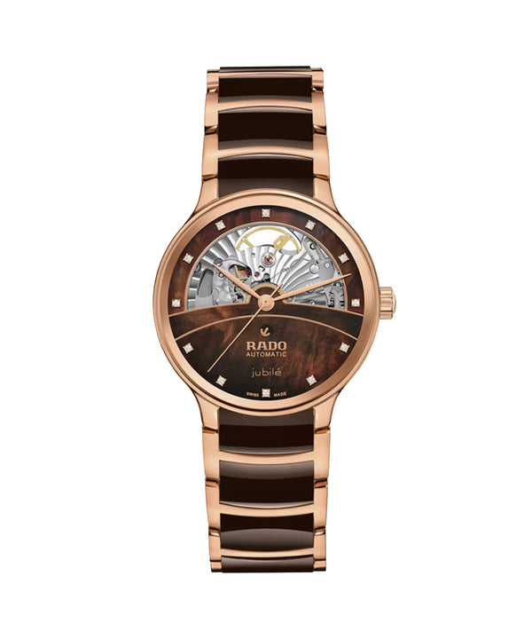 Rose gold and brown watch with Rado branding on a white background