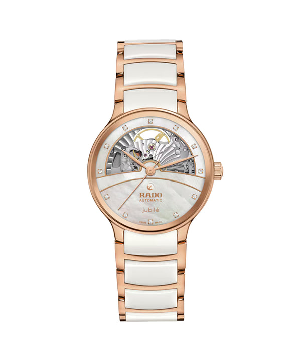 Rose gold and white ceramic watch with Rado brand on a white background