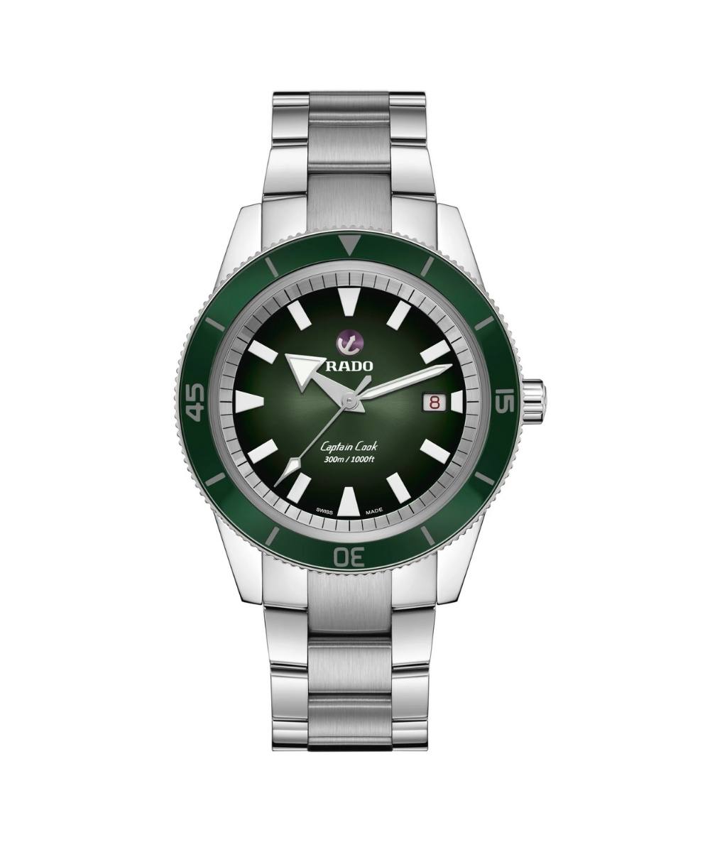 Watch with green dial and silver bracelet on a white background