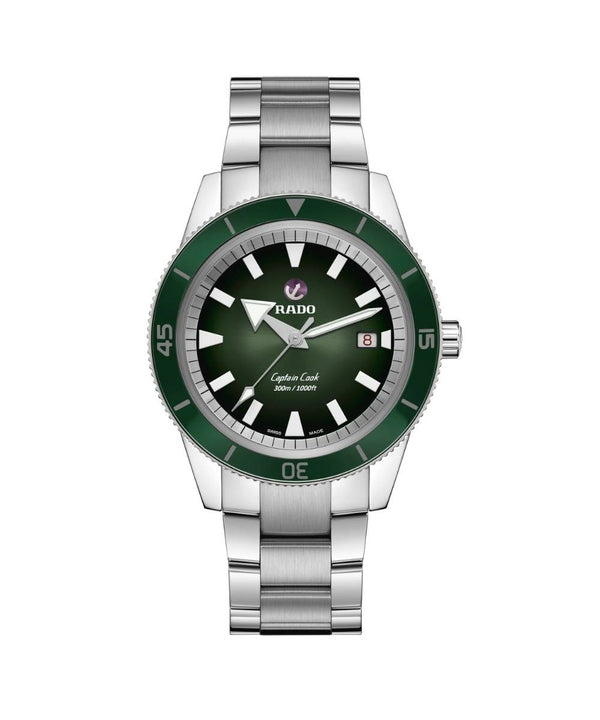 Watch with green dial and silver bracelet on a white background