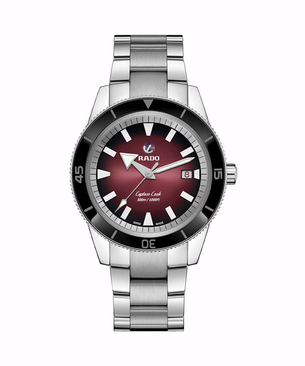 Silver watch with a red face on a white background