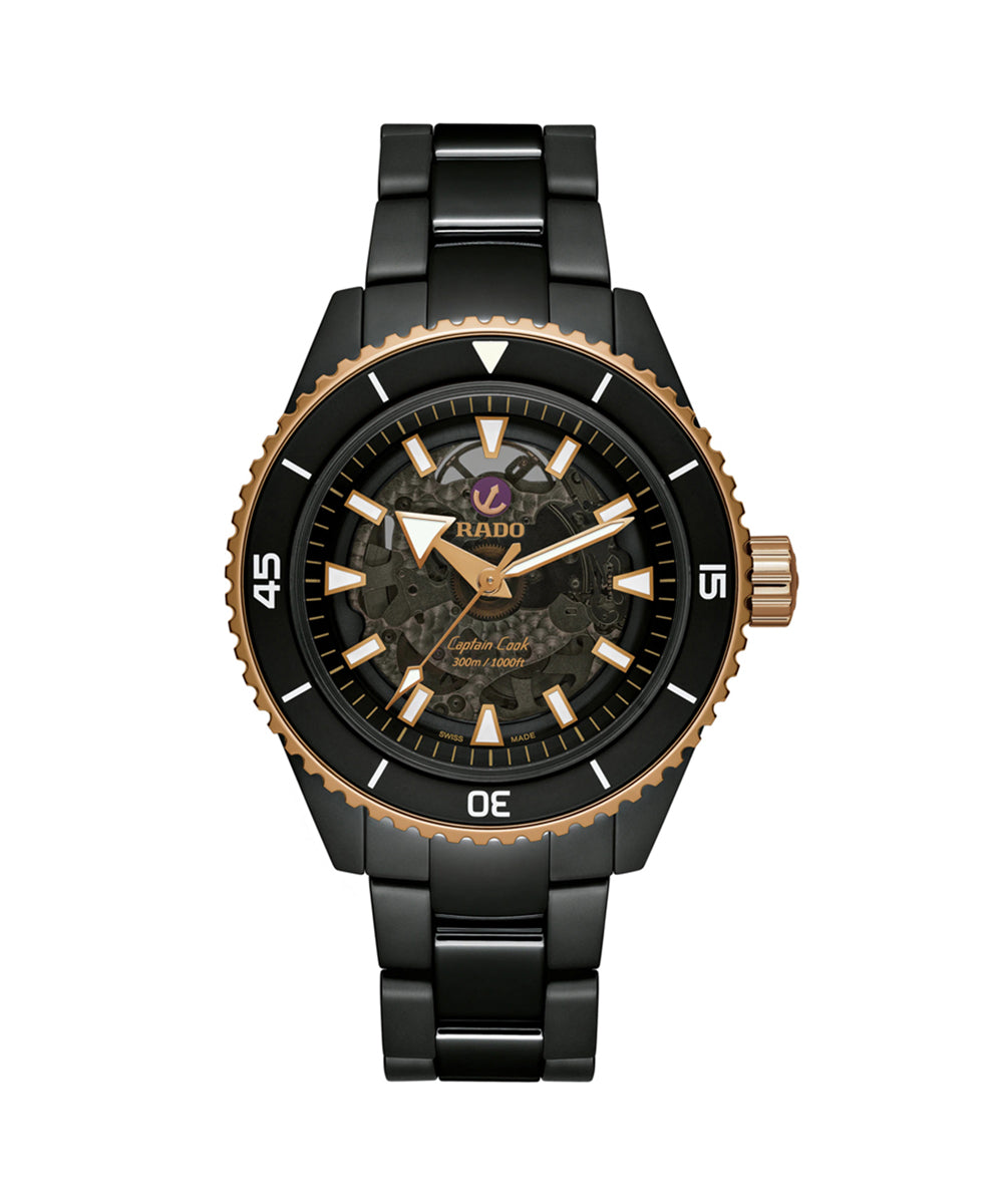 Black and rose gold watch with detailed face on a white background