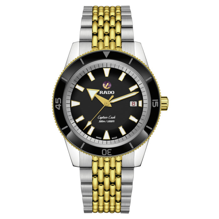 Rado watch with black face, gold and silver band on white background