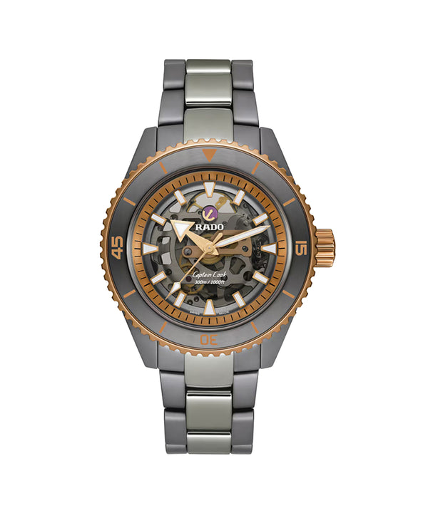 Watch with metallic band and detailed face on a white background