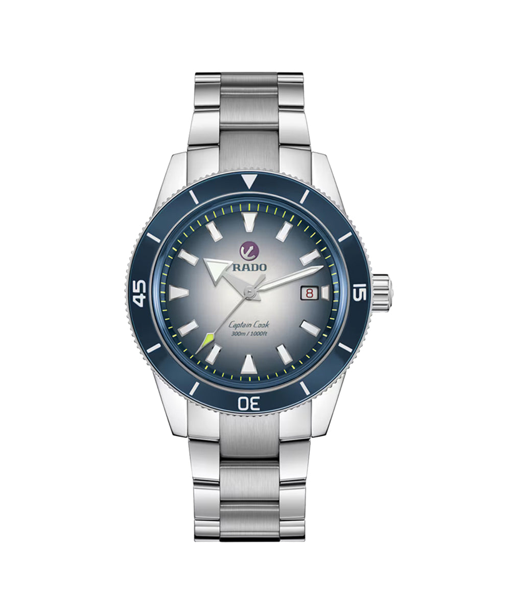 Silver watch with blue bezel on a white background