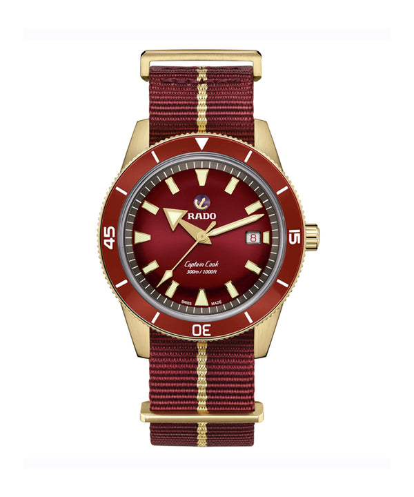 Watch with red face and maroon strap on a white background