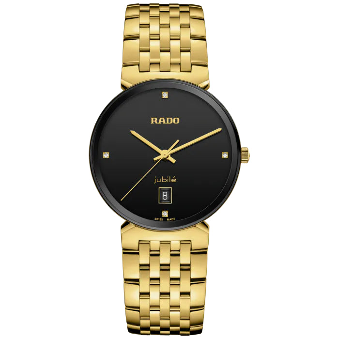 Gold watch with black dial on a white background