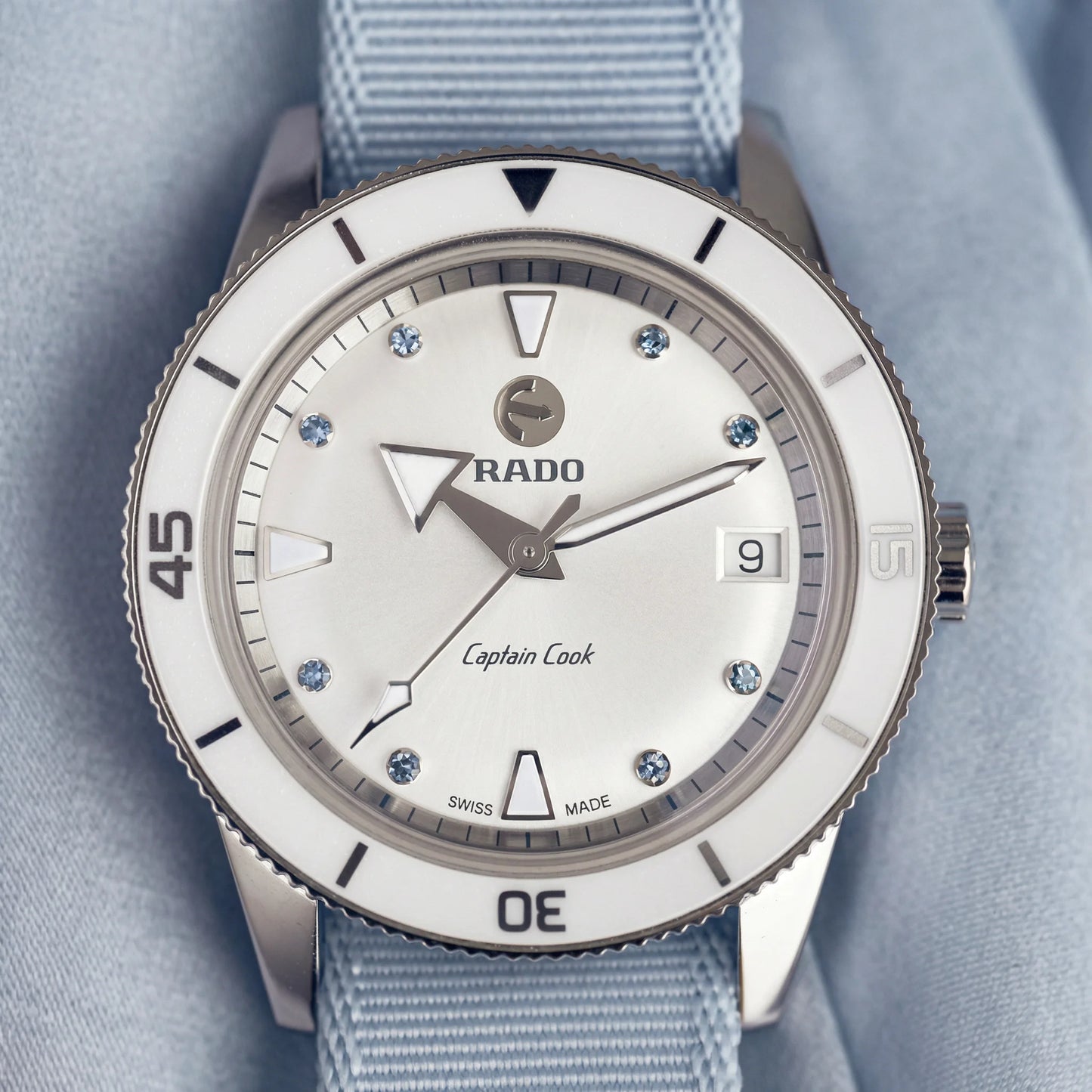 Men's Tissot PRX stainless steel watch with a blue waffle-textured dial.