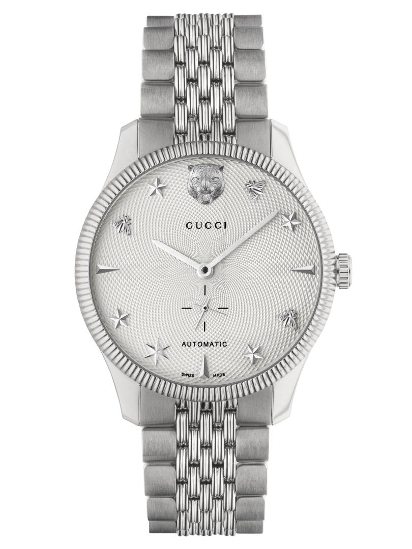 Silver Gucci watch with detailed face on a white background