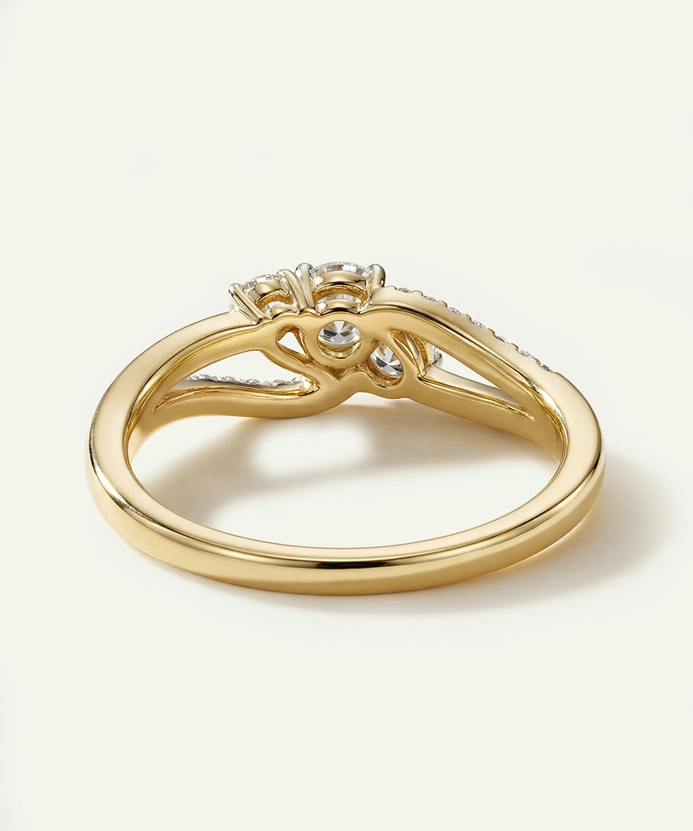 Gold ring with diamond accents on a white background