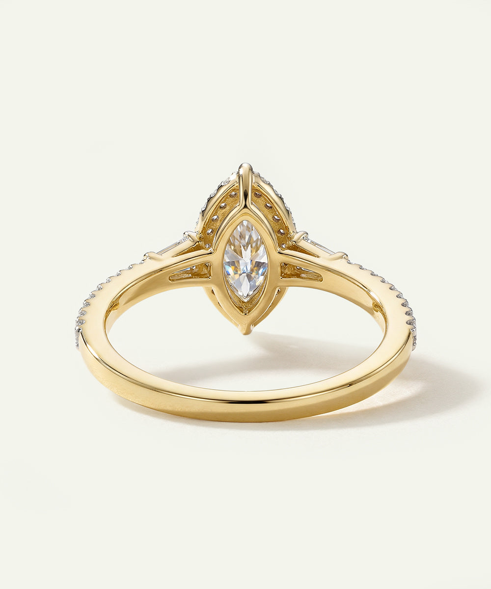 Gold ring with a diamond on a light background