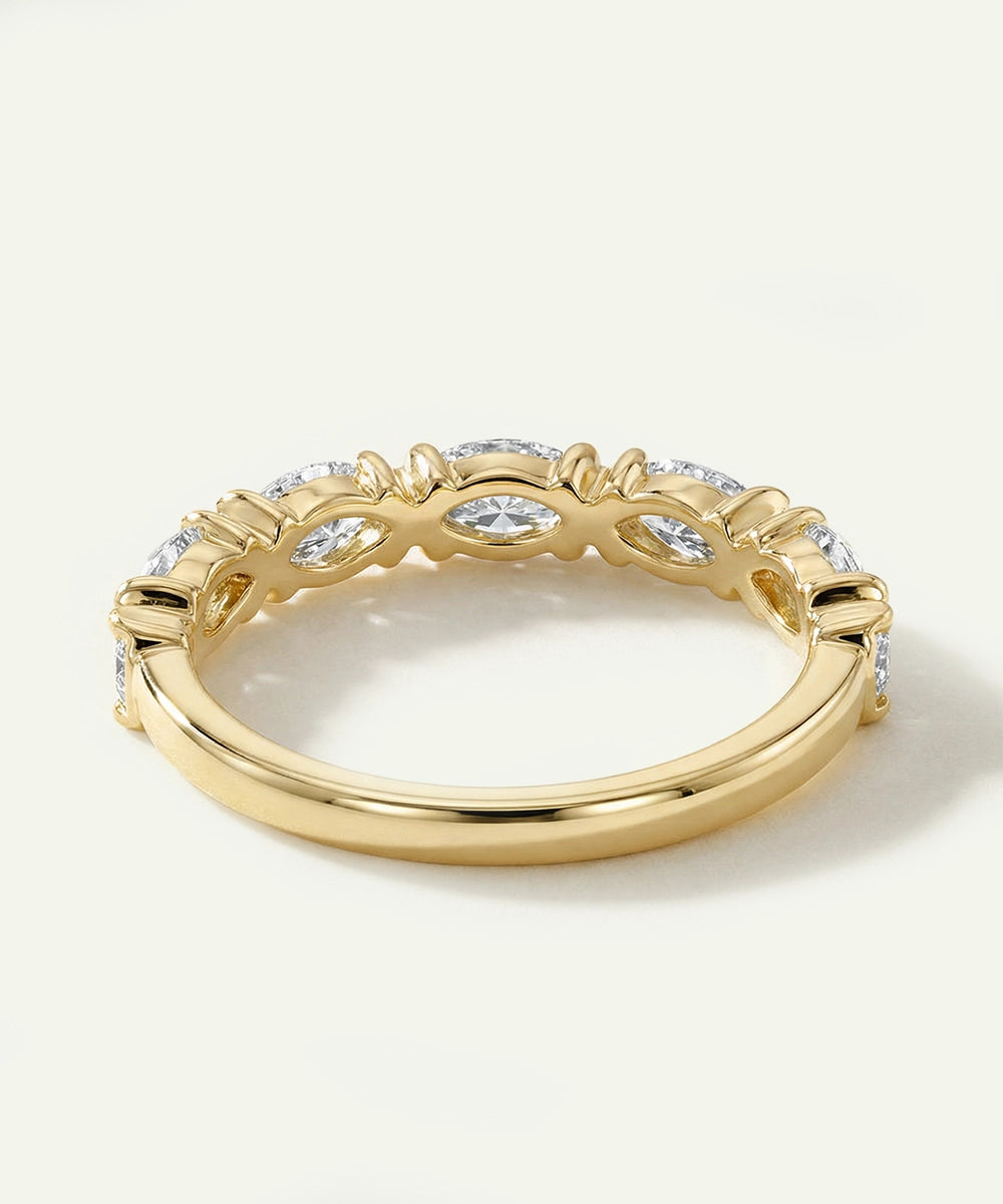 Gold ring with diamonds on a white background