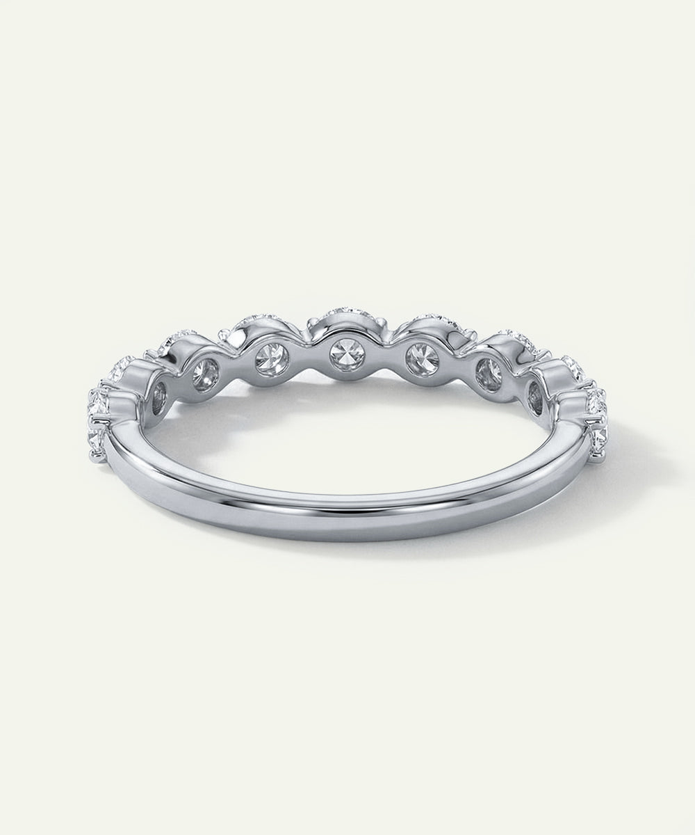 Silver ring with diamonds on a white background