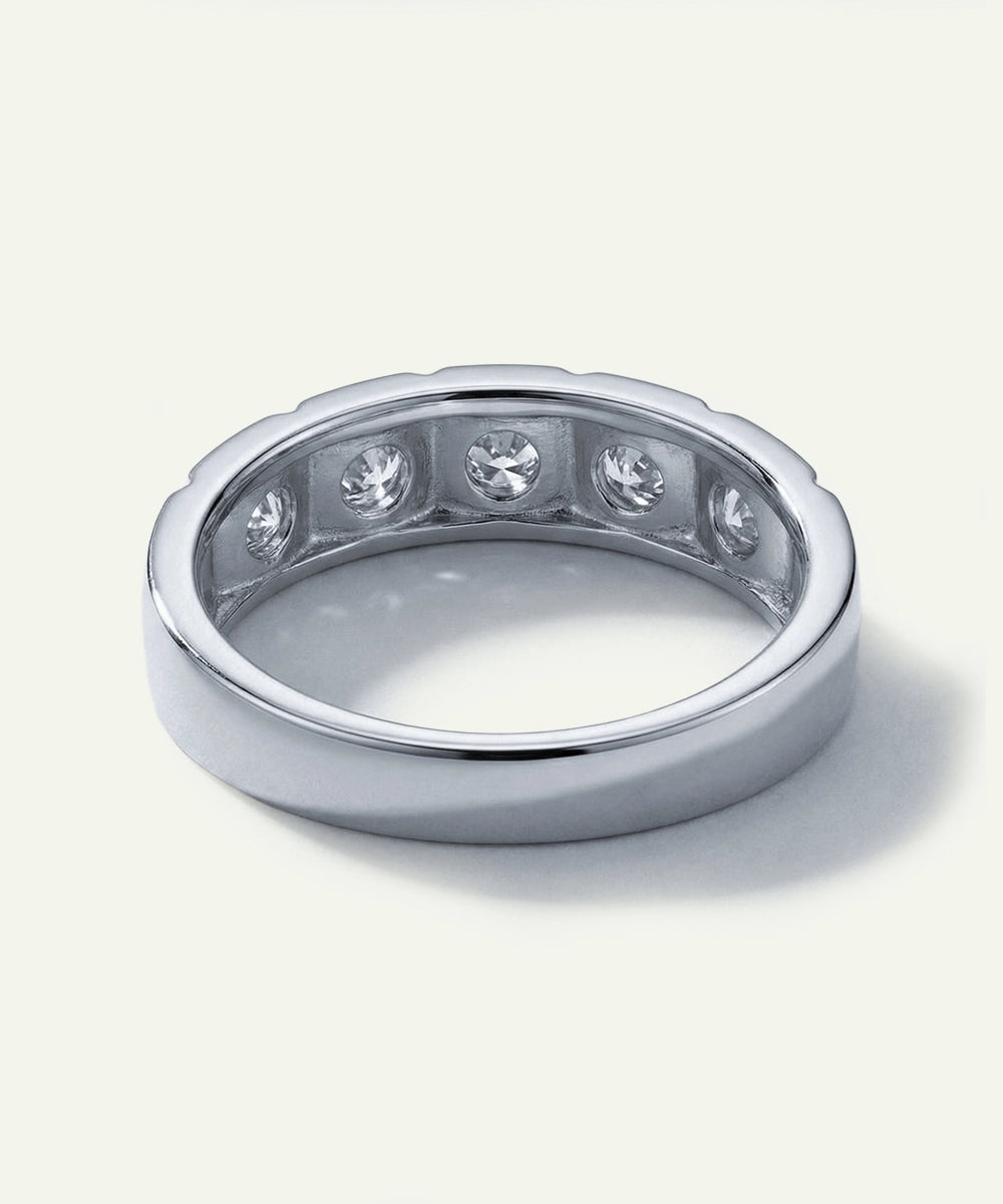 Silver ring with embedded diamonds on a white background