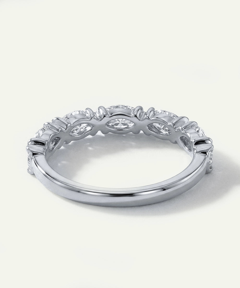 Silver ring with diamond accents on a white background