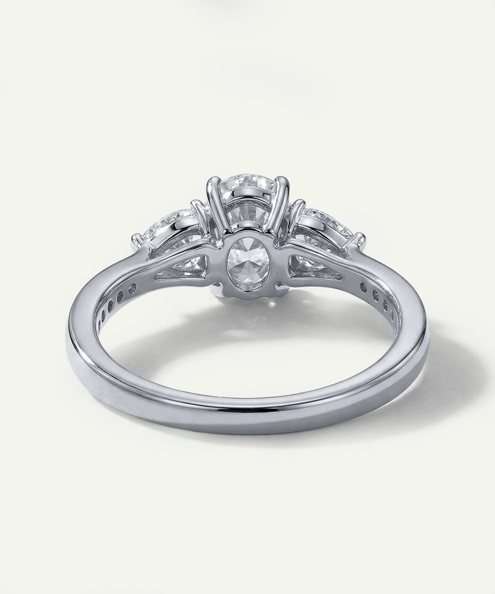 Silver ring with multiple diamonds on a white background