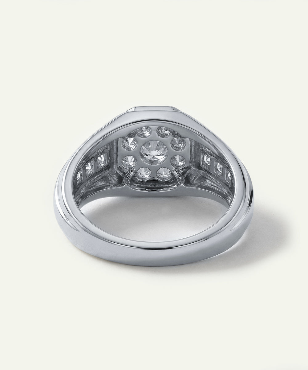 Silver ring with embedded diamonds on a white background