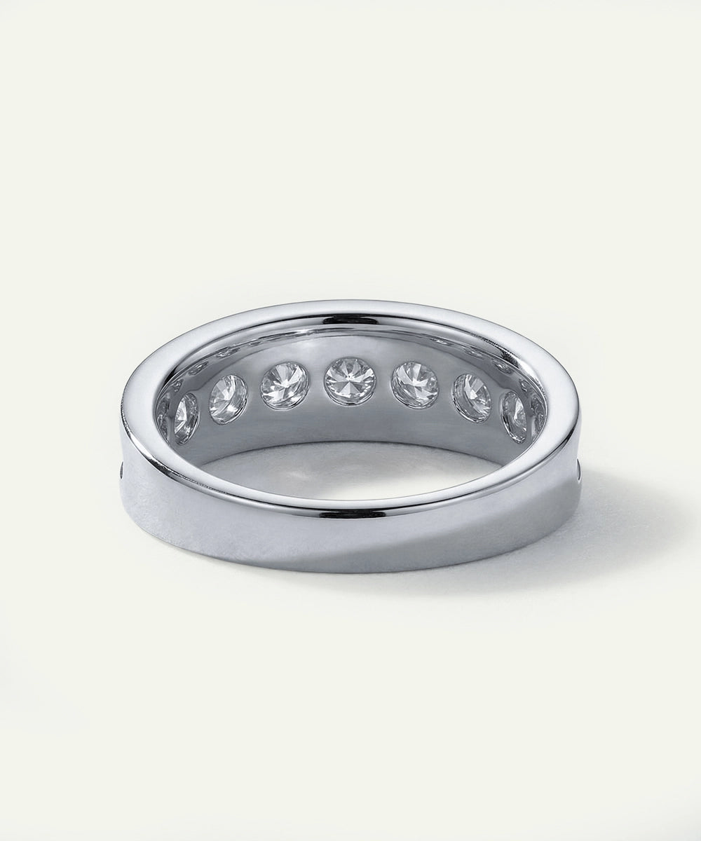 Silver ring with embedded stones on a white background
