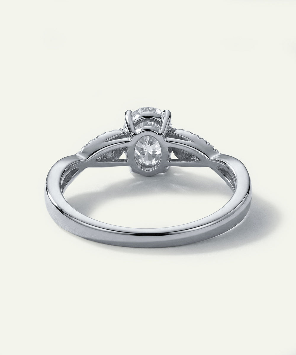 Silver ring with a diamond on a white background