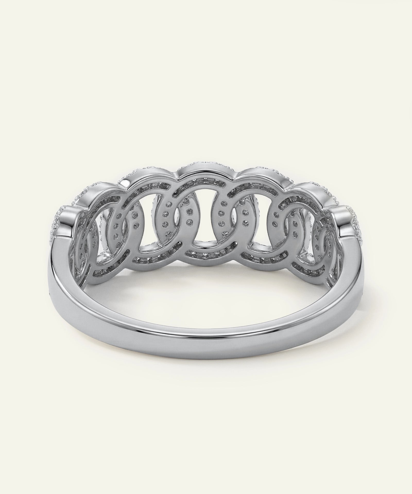 Silver ring with interlocking loops on a white background