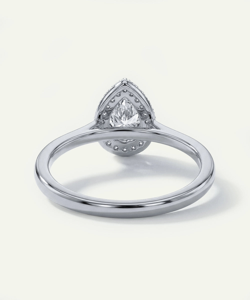 Silver ring with a diamond on a white background