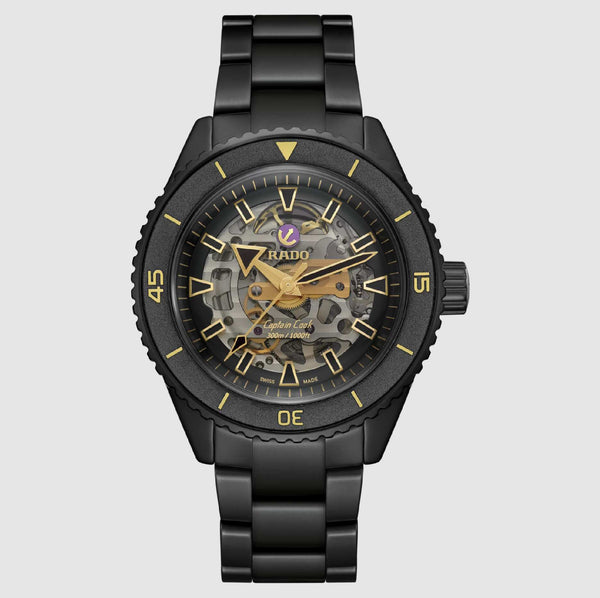 Black Rado watch with gold accents on a white background