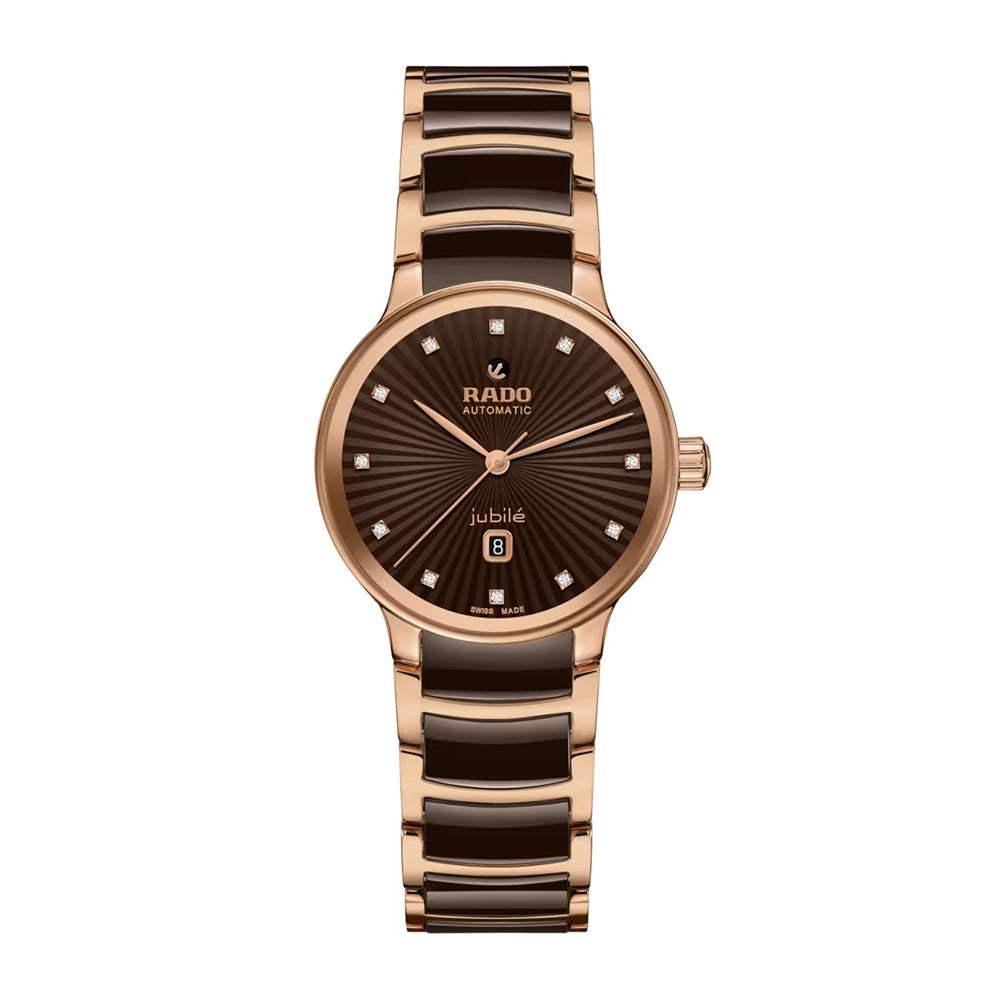 Rose gold and brown watch with Rado branding on a white background
