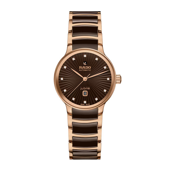 Rose gold and brown watch with Rado branding on a white background