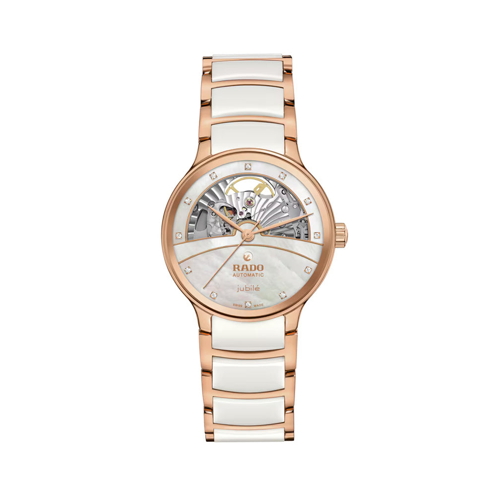 Rose gold and white ceramic watch with Rado brand on a white background