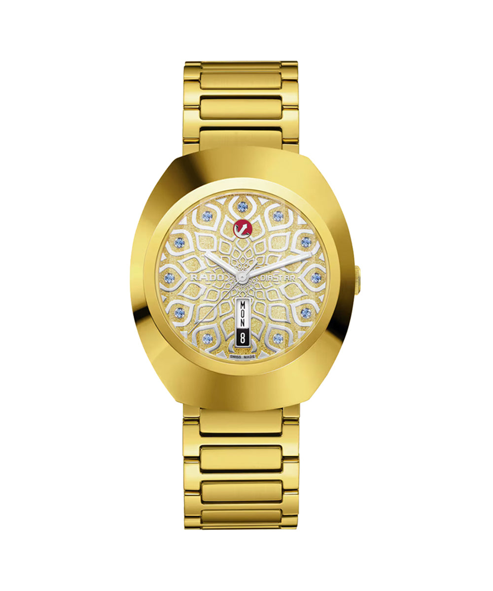 Gold watch with intricate design on the face against a white background