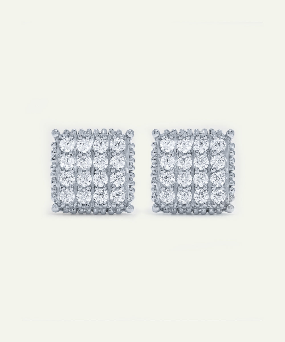 Pair of square-shaped diamond earrings on a white background