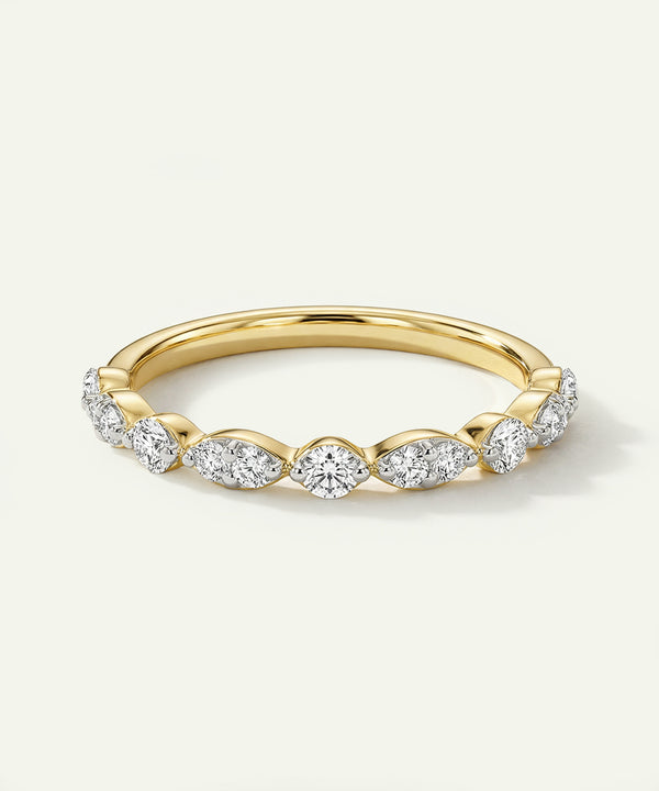 Gold ring with diamond stones on a white background