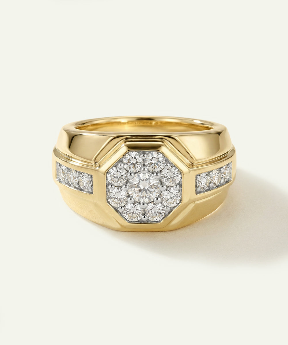 Gold ring with diamond accents on a light beige background
