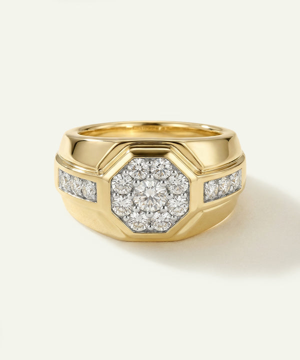 Gold ring with diamond accents on a light beige background