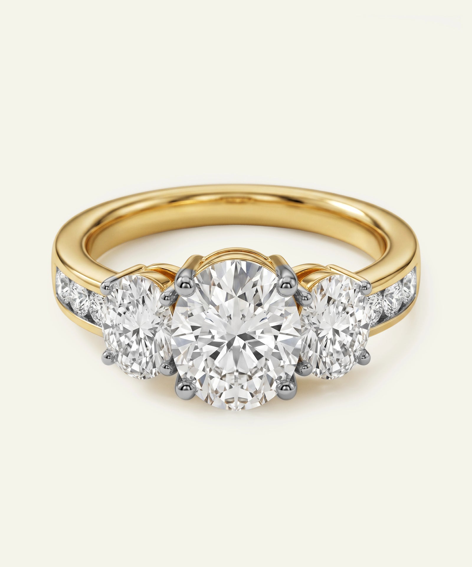 Gold ring with three diamond stones on a white background