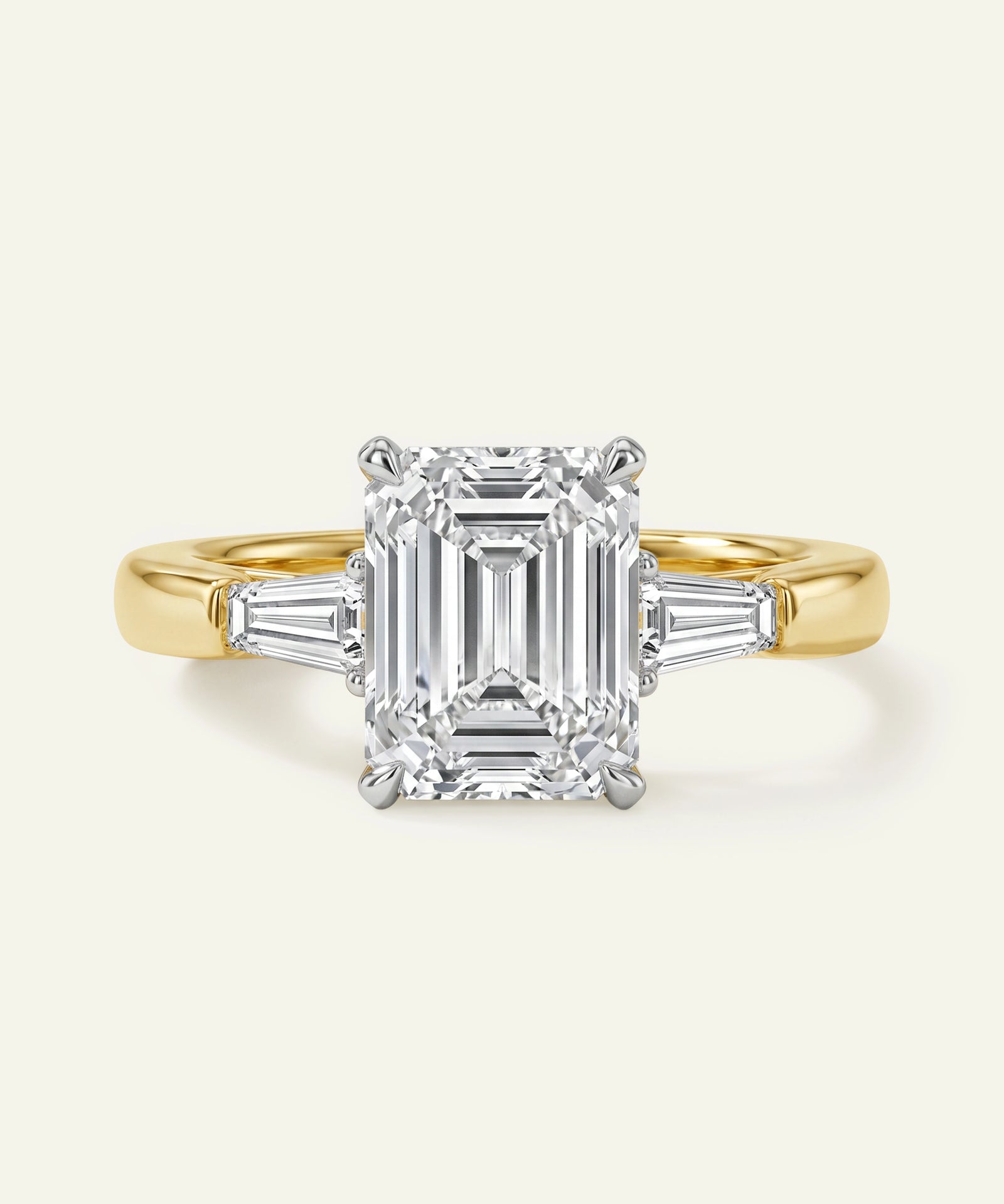 Gold ring with a diamond on a white background