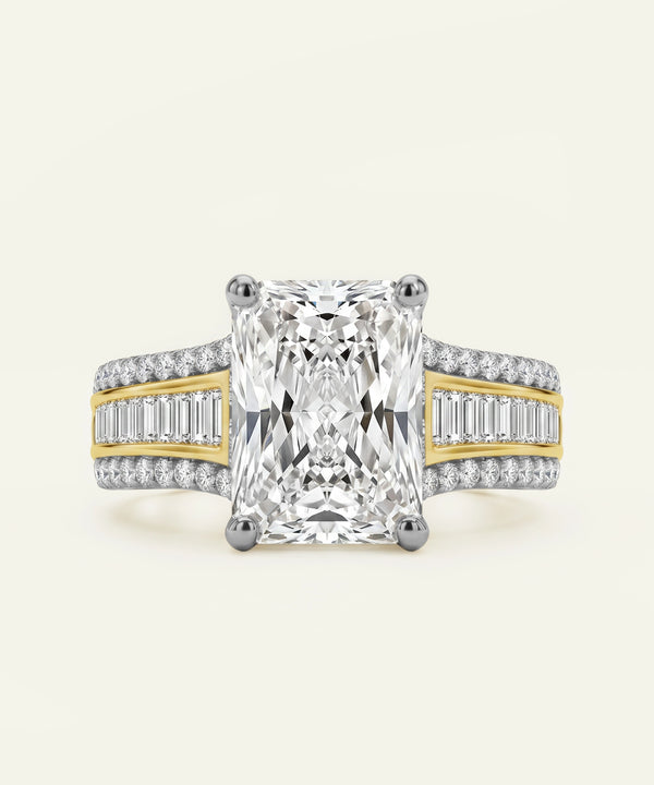 Two-tone diamond ring with a large central diamond and smaller diamonds on the band against a white background.