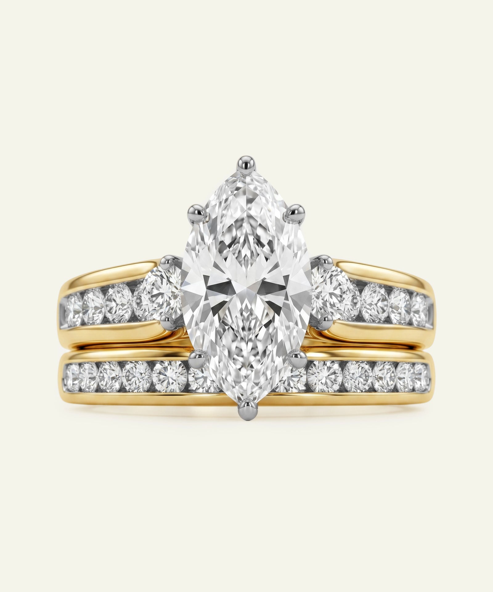 Gold ring with a pear-shaped diamond and smaller diamonds on a white background