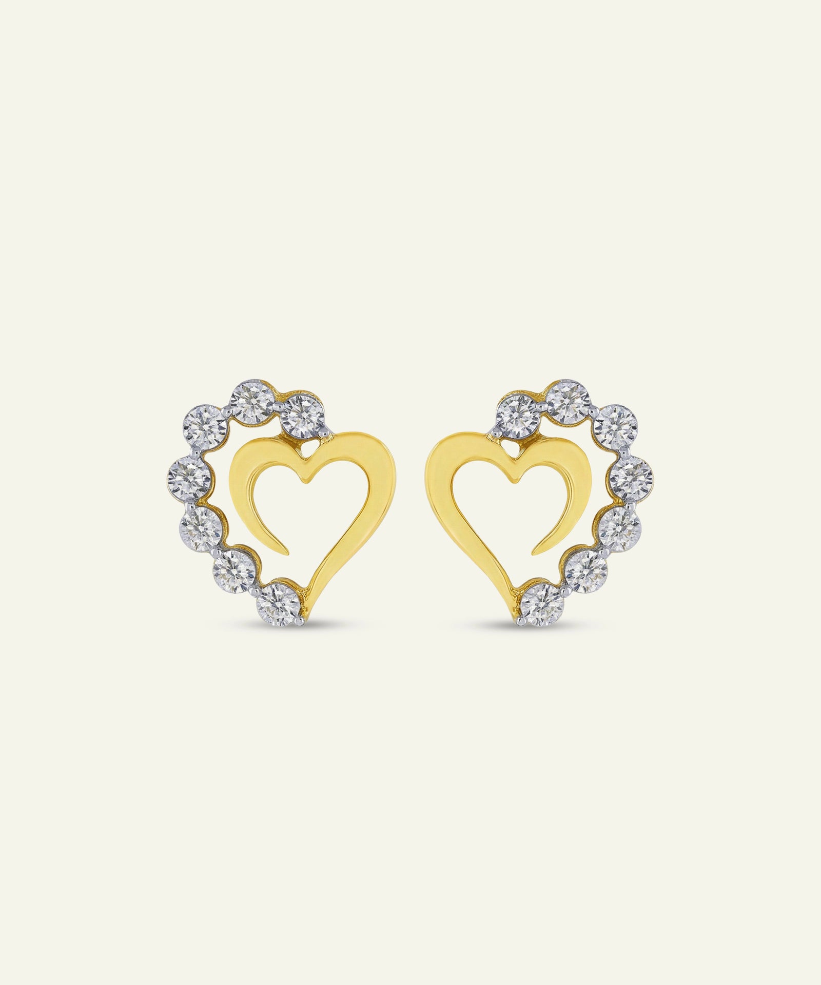 Pair of gold heart-shaped earrings with diamond accents on a white background
